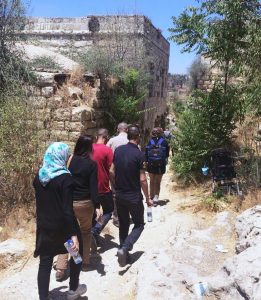 PNE participants touring the Palestinian village of Lifta.